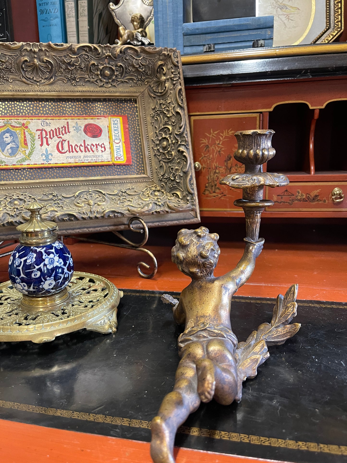 Antique Bronze-Style Cherub Candlestick – Tole Putto with Torch Lying on Laurel Branches