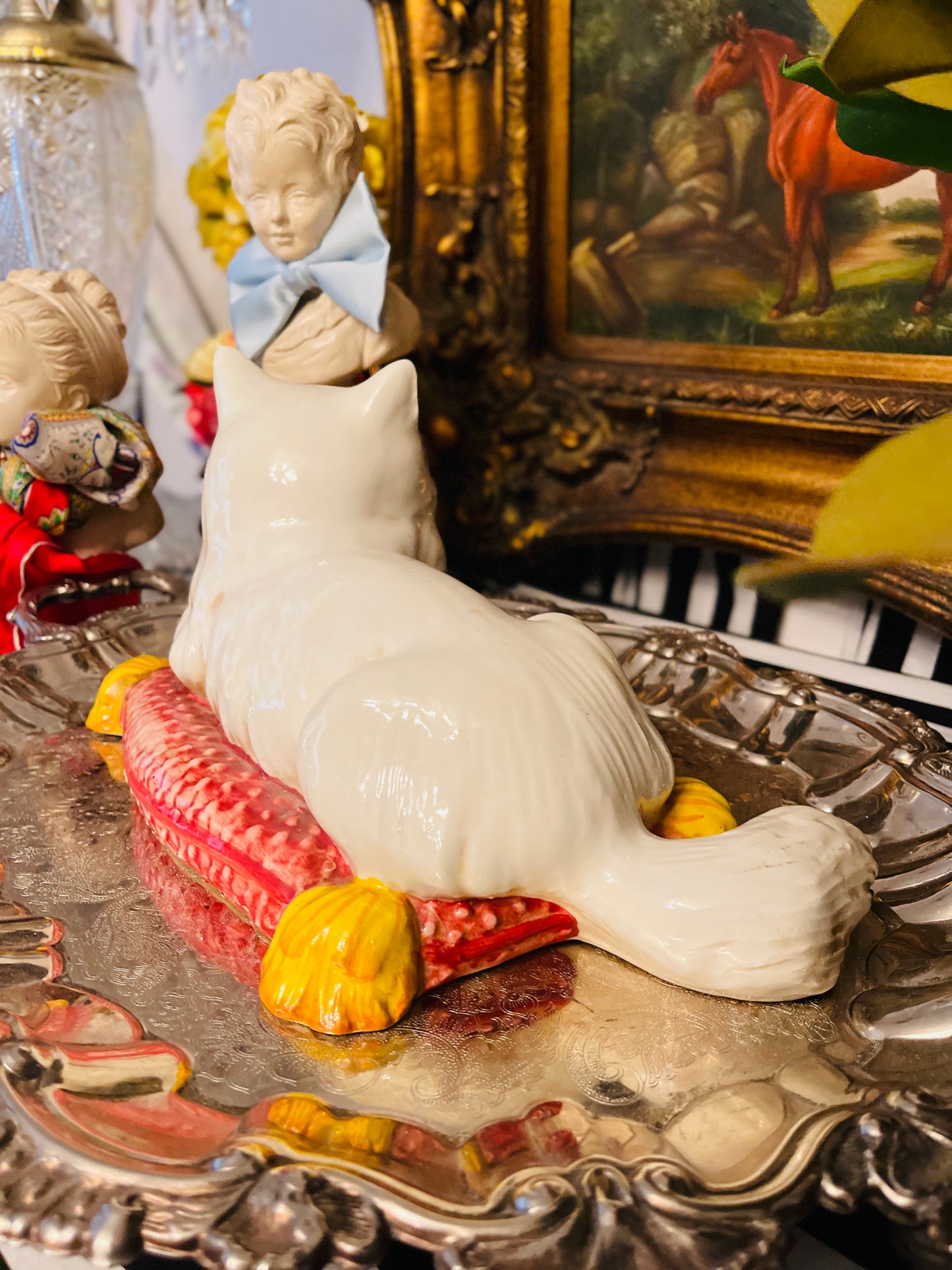 Italian White Persian Cat Lounging on a Pink Pillow with Yellow Tassels