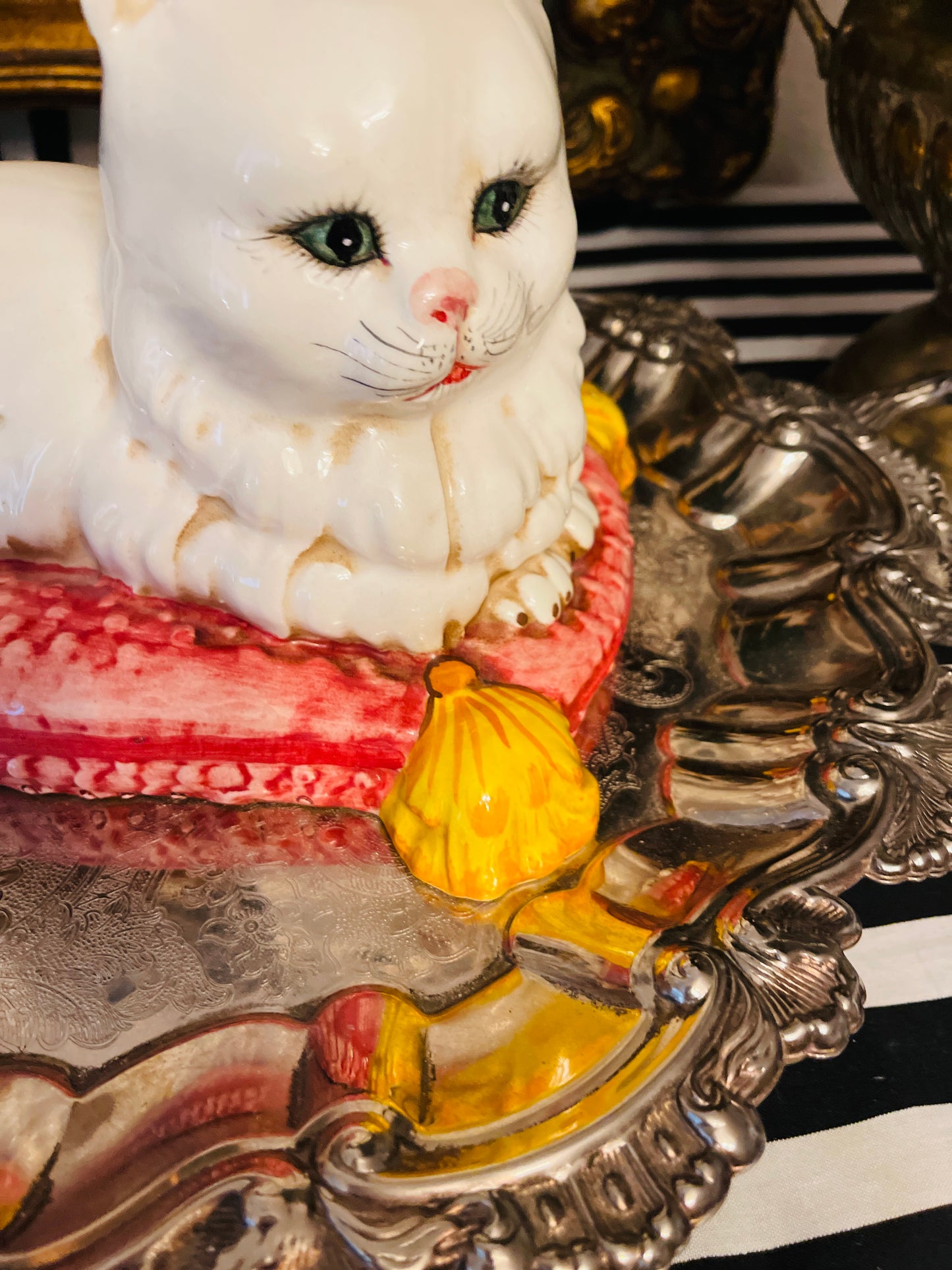 Italian White Persian Cat Lounging on a Pink Pillow with Yellow Tassels