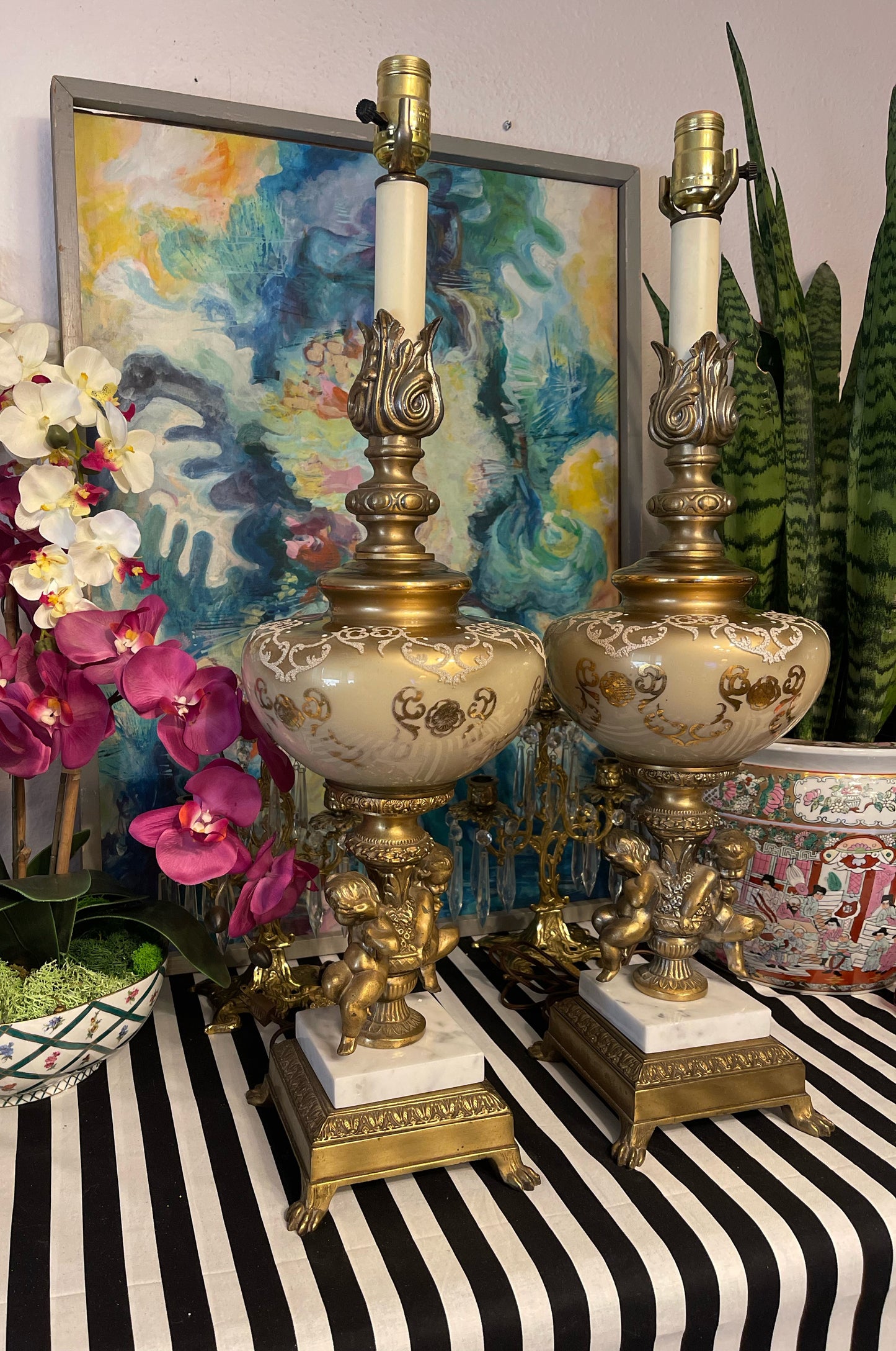 Pair of Hollywood Regency Double Gilt Tole Cherub and Brass Ormolu Lamps, Mid Century