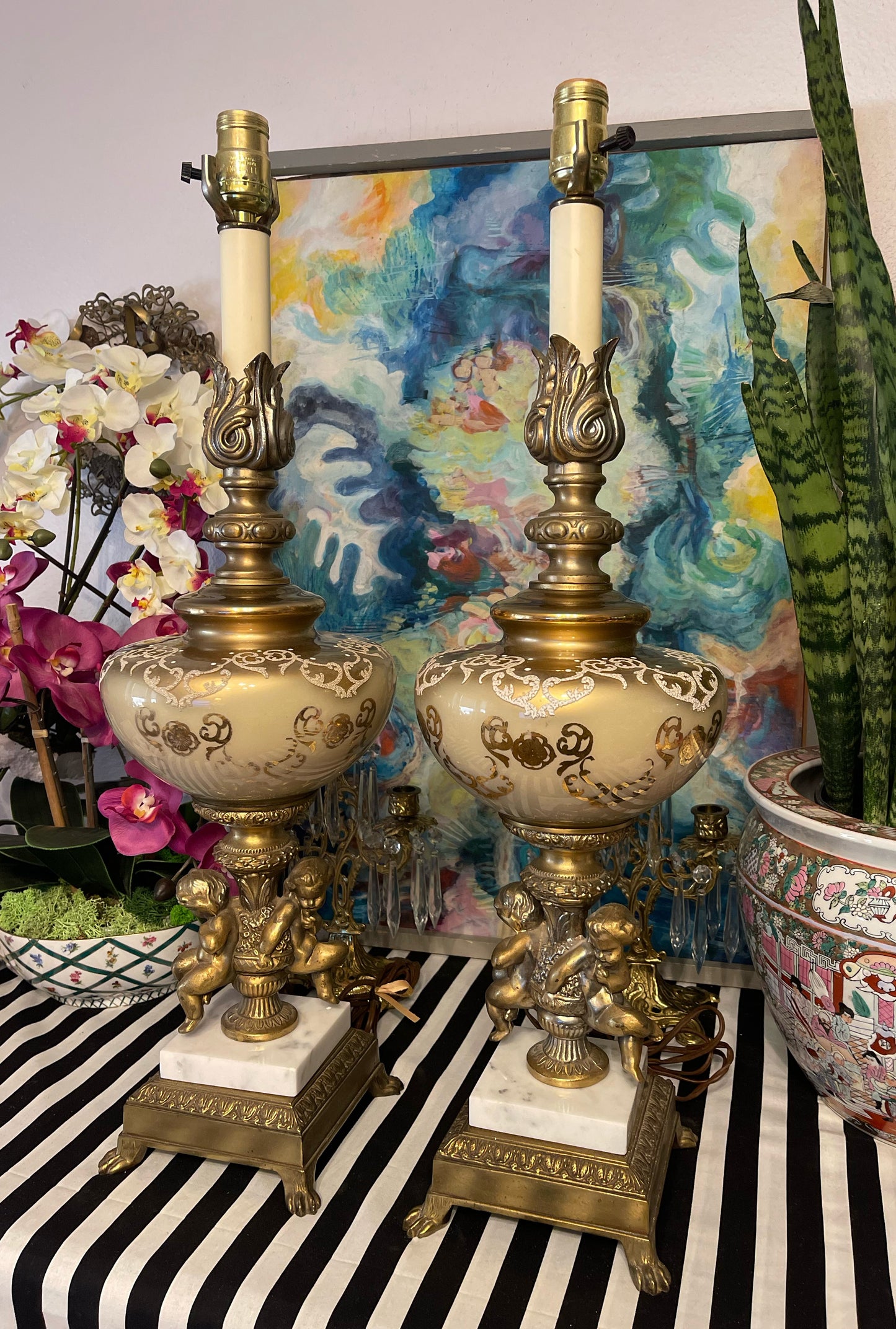 Pair of Hollywood Regency Double Gilt Tole Cherub and Brass Ormolu Lamps, Mid Century