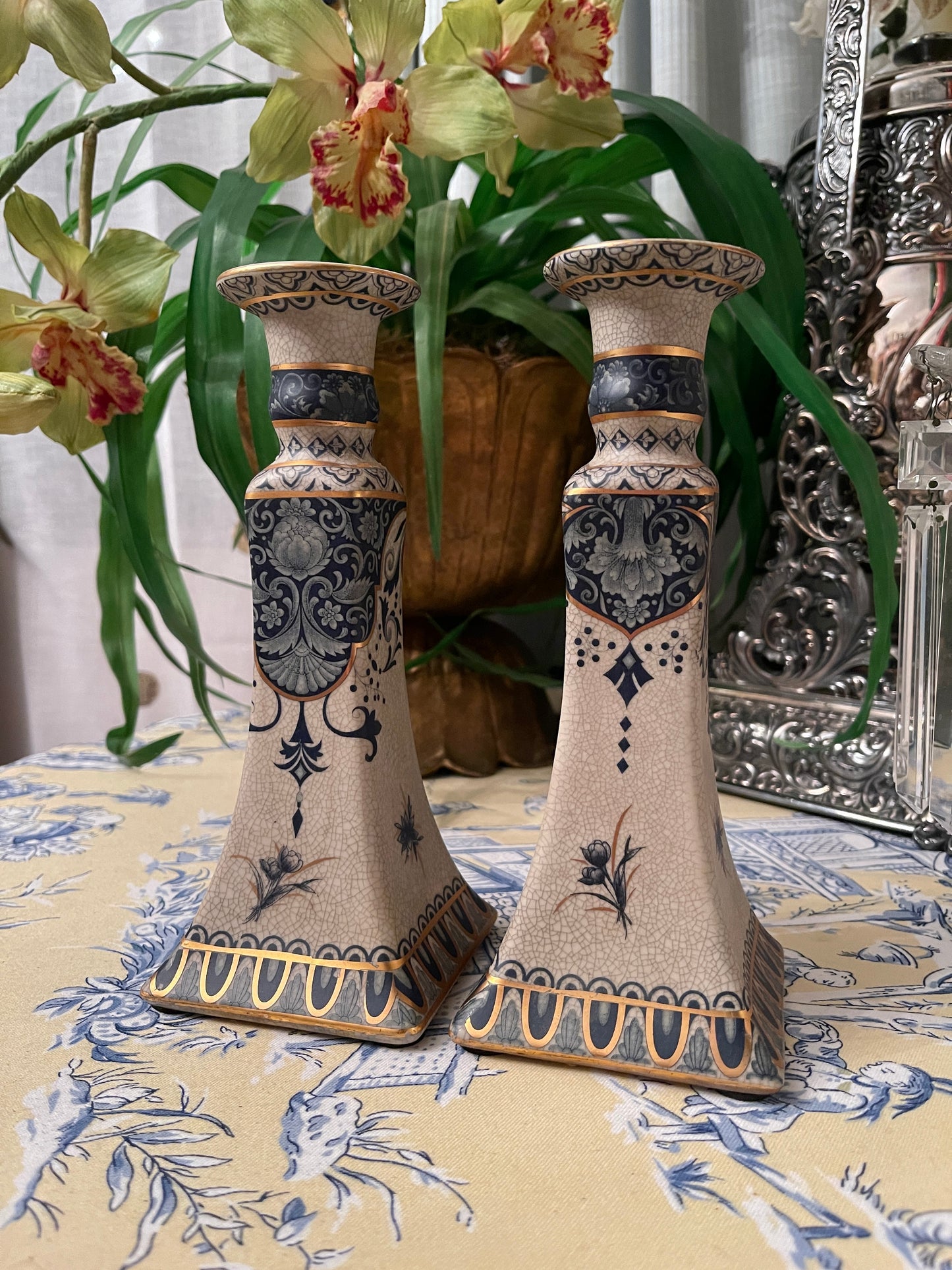 Vintage candlesticks with varying shades of blue and gold on an intentionally crazed finish, Beautifully detailed