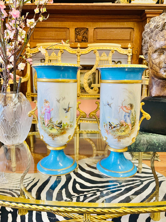Pair of Antique French Porcelain Urns with Hand-Painted Cherub Scenes
