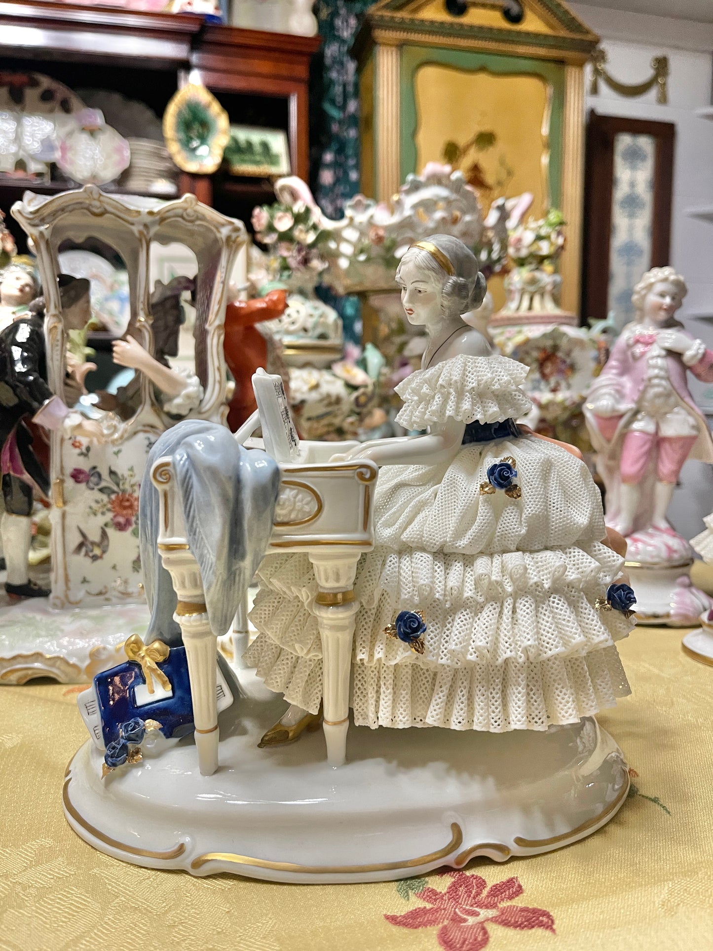 Vintage Royal Dux Bohemia Porcelain Lady at the Piano Figurine, White Porcelain with Blue Applied Roses & Pink Bow — Mid-Century European Figurine