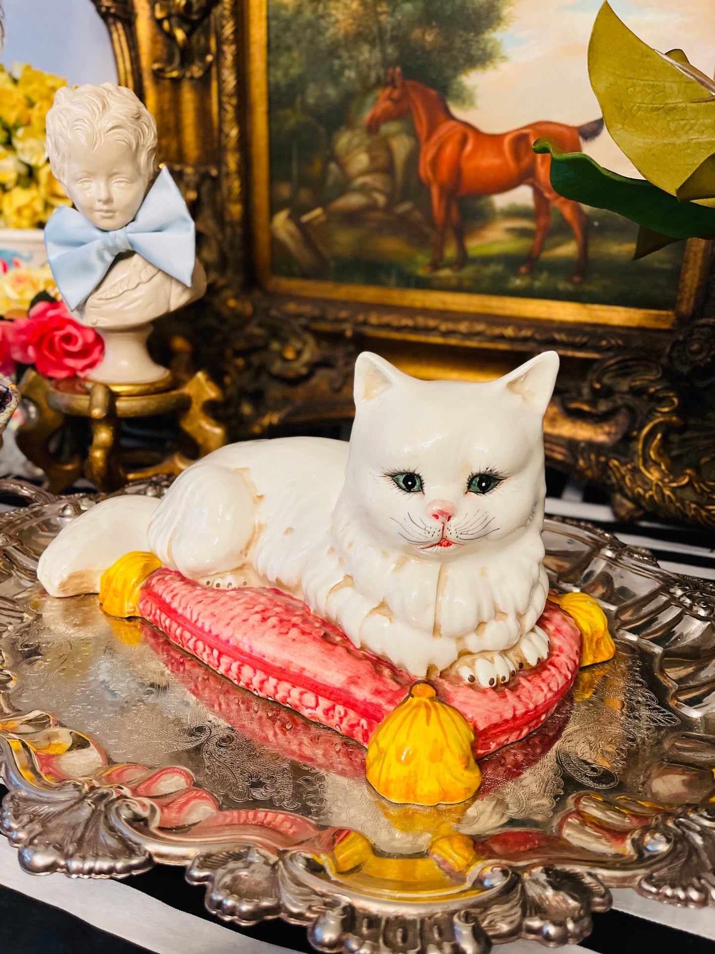 Italian White Persian Cat Lounging on a Pink Pillow with Yellow Tassels