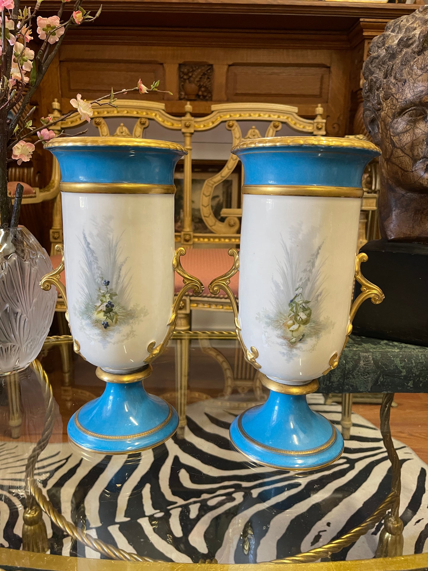 Pair of Antique French Porcelain Urns with Hand-Painted Cherub Scenes