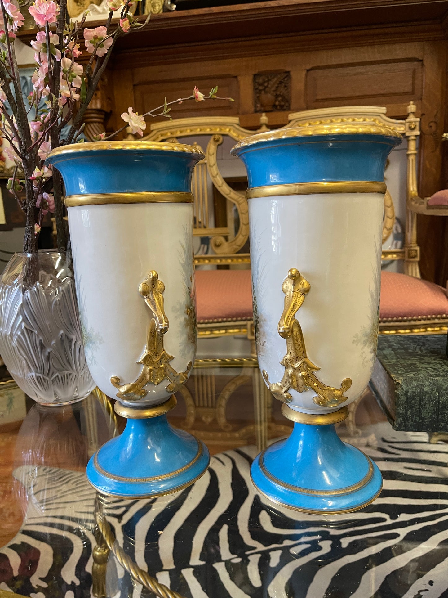 Pair of Antique French Porcelain Urns with Hand-Painted Cherub Scenes