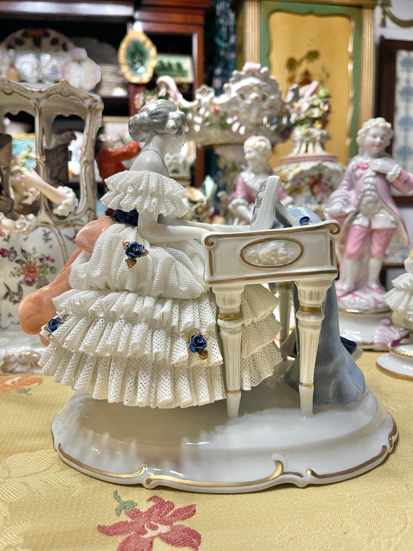 Vintage Royal Dux Bohemia Porcelain Lady at the Piano Figurine, White Porcelain with Blue Applied Roses & Pink Bow — Mid-Century European Figurine