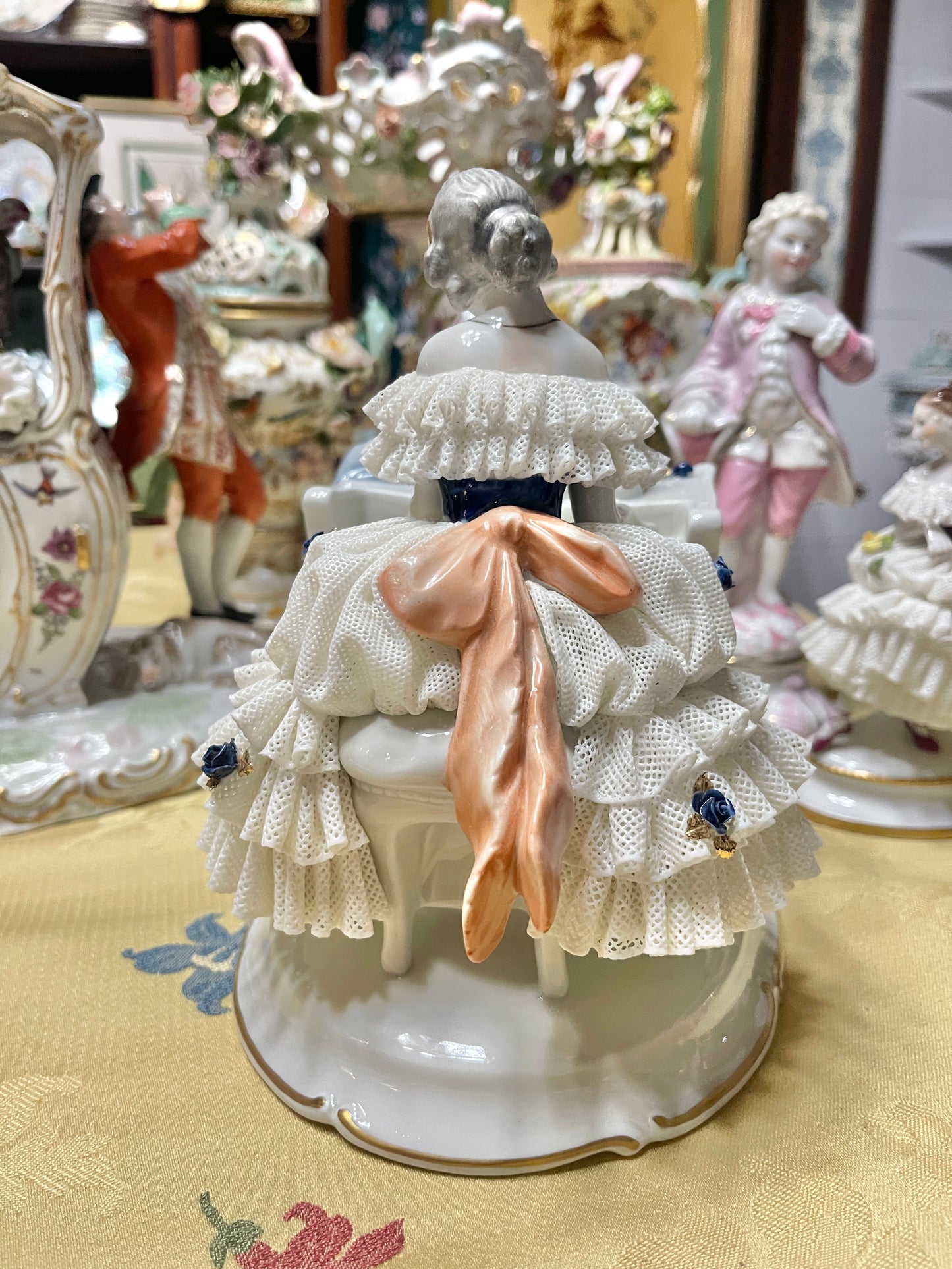 Vintage Royal Dux Bohemia Porcelain Lady at the Piano Figurine, White Porcelain with Blue Applied Roses & Pink Bow — Mid-Century European Figurine