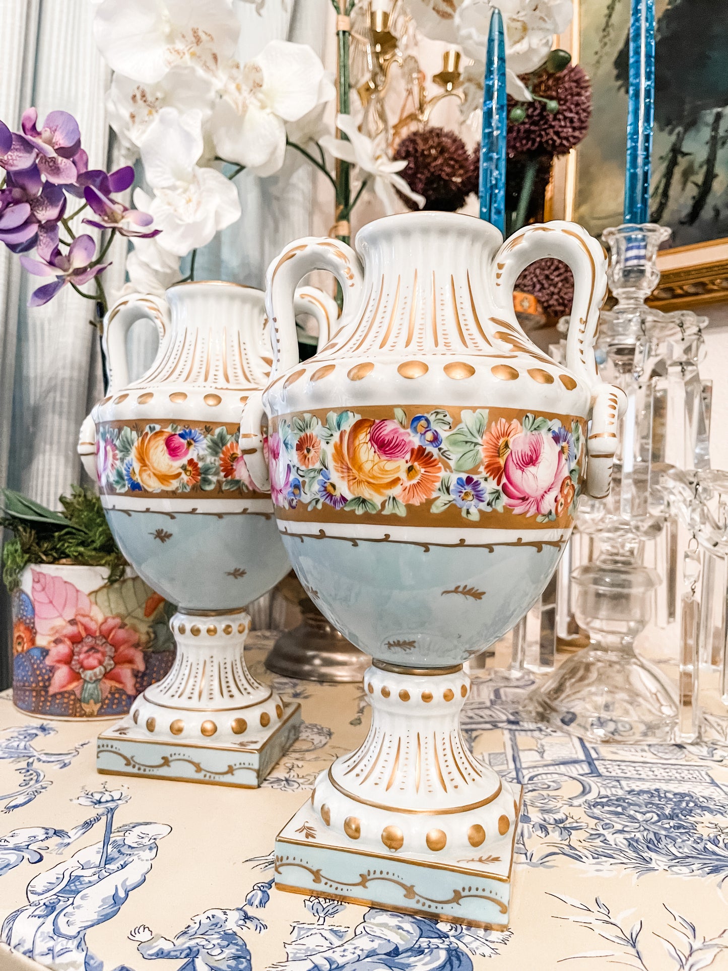 Pair of Limoges Blue and Gold Urns with Hand Painted Florals and Gilt Detail, Made in France