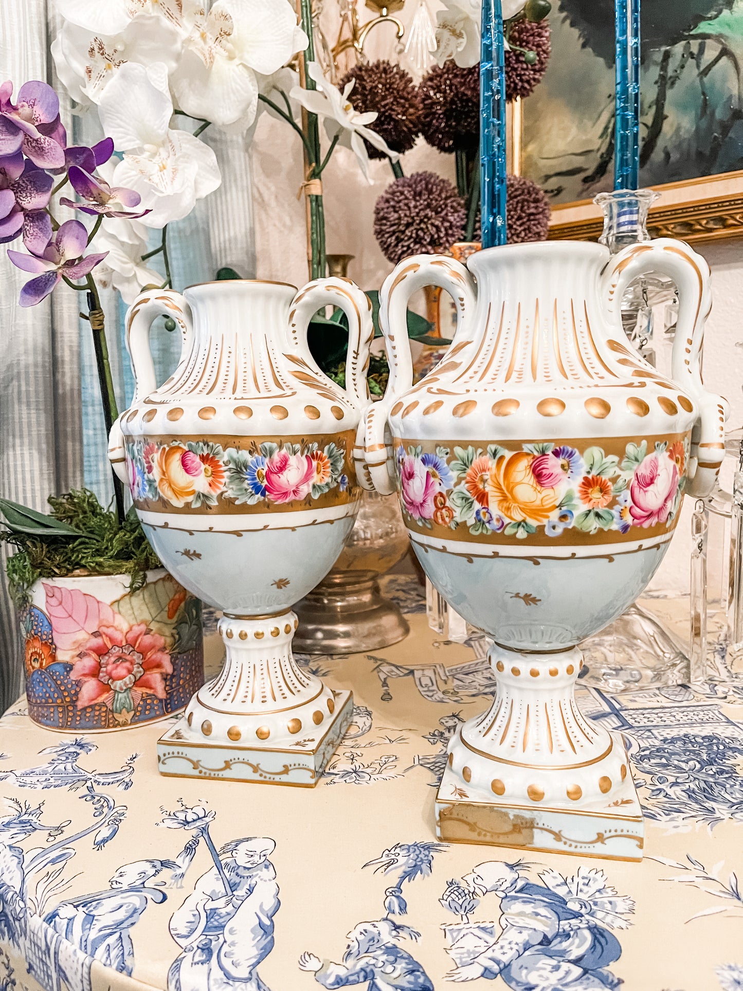 Pair of Limoges Blue and Gold Urns with Hand Painted Florals and Gilt Detail, Made in France