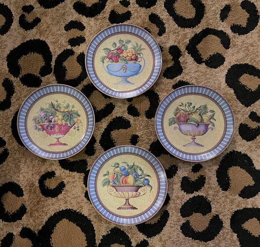 French blue, pink, green, gold, lavendar, green, and red make up the colors in these fantastic plates. the set of four is an instant plate wall disply.  All 4 feature a different style of urn filled with fruit. The border is two different colors of blue coastal and french stripes. So pretty! Grandmillennial, cottage, preppy, traditional decor.